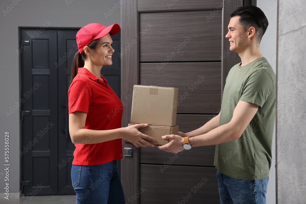 Poster Courier giving parcel to customer at house entrance