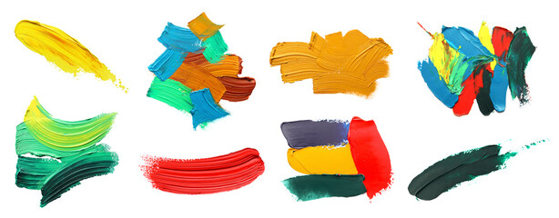 Set with strokes of colorful oil paints on white background, top view