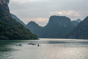 Kayakers on the water in the Ha Long Bay UNESCO World Heritage site in Qiang Ninh Province in northern Vietnam