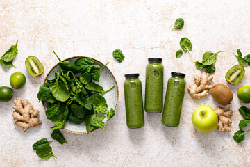Smoothie. Healthy fresh raw detox spinach smoothie with green apple, kiwi and ginger in a bottles on a table. Healthy diet vegan food full of antioxidants. Top view - obrazy, fototapety, plakaty