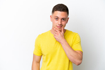 Young brazilian man isolated on white background thinking