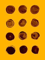 Set of brown monochrome acrylic circles on orange background - 575560655