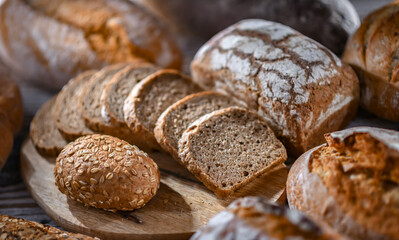 Assorted bakery products including loaves of bread and rolls