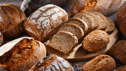 Assorted bakery products including loaves of bread and rolls