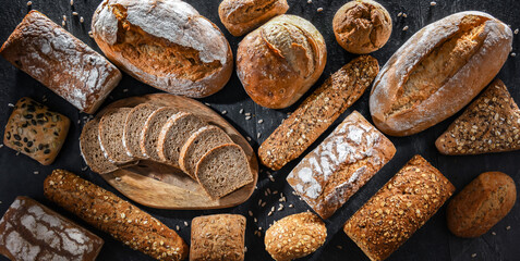Assorted bakery products including loafs of bread and rolls