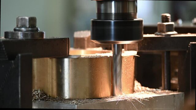 Slot milling process the ring brass material part on NC milling machine.