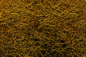 Surface of crumpled silver foil close-up.