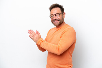 Middle age caucasian man isolated on white background applauding