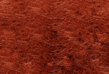 Red gold crumpled foil surface.