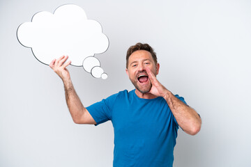 Middle age caucasian man isolated on white background holding a thinking speech bubble and shouting