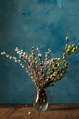 flowering willow and boxwood in a glass decanter © Mallivan