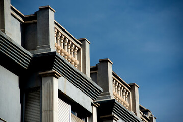 Fototapeta na wymiar Balconies in a gray building, one day in February