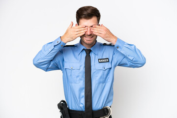 Young police caucasian man isolated on white background covering eyes by hands