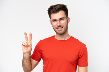 Fototapeta premium Young caucasian man isolated on white background With glasses and doing OK sign