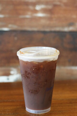 Americano coffee on old wooden table in cafe