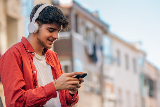 young man with headphones and mobile phone