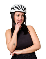 Young caucasian woman wearing a helemet isolated relaxed thinking about something looking at a copy space.