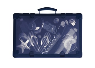 X-ray scan of a suitcase with travel and vacation accessories inside