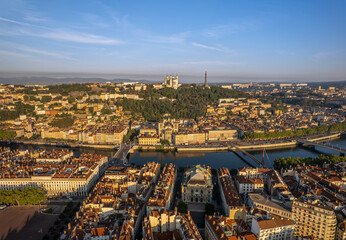 Obraz premium The drone panoramic view of The Basilica of Notre-Dame de Fourvière, Saone River and downtown district of Lyon, France.
