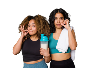 Two best friends are ready to go to the gym, one of them holds a protein shake, with fingers on lips keeping a secret.