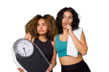 Two ethnically diverse friends head to the gym together, motivated and focused on fitness. One holds a scale, symbolizing dedication to diet and discipline.