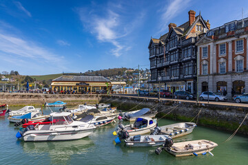 Fototapeta na wymiar Boats moored in the lovely little square inner harbour at Dartmouth in Devon.