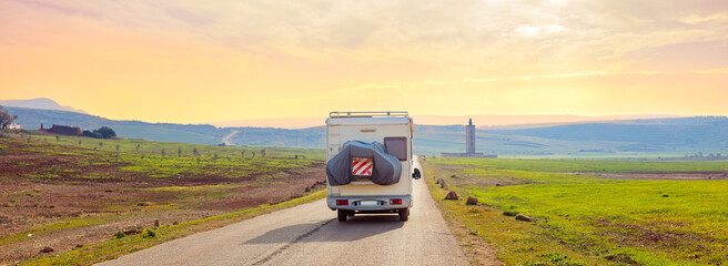motorhome on the road- vacation,  travel or adventure concept- Morocco - obrazy, fototapety, plakaty