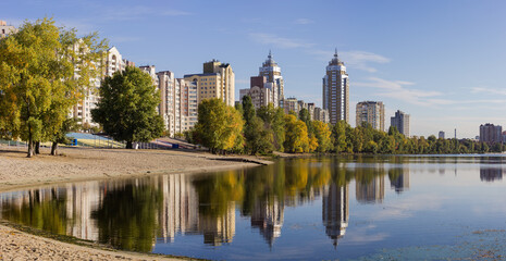 Modern apartment complex with multistory buildings on the river bank