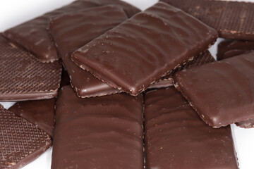 Slices of dark chocolate, close-up in selective focus