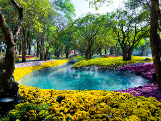 Naklejka premium Beautiful spring park with multicolor flowers.