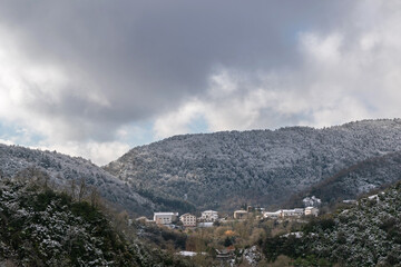 Fototapeta na wymiar Village in the snowy mountains. Urtasun. Esteribar Valley, Navarra