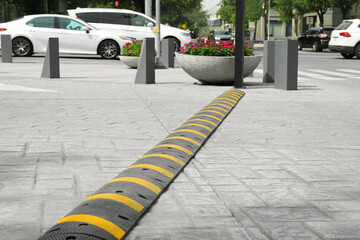 City street with striped plastic speed bump