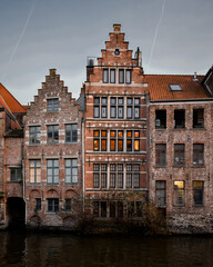 Canal houses in Ghent, Belgium during sunset - 575577869