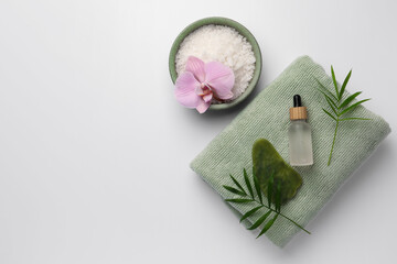 Flat lay composition with different spa products on white background. Space for text