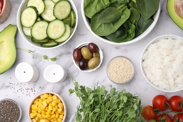 Ingredients for poke bowl on white marble table, flat lay
