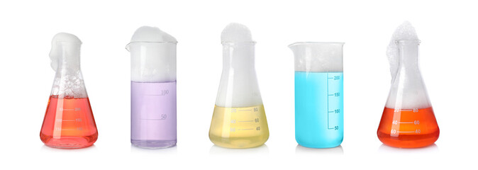 Set of laboratory flasks and beakers with colorful liquids on white background. Chemical reaction