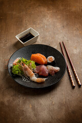 mix sashimi  soy sauce and chopstick