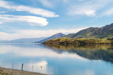 Reflections of the mountains in Lake Hawea, New Zealand 