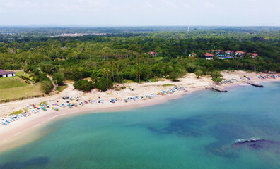 Aerial view of the tropical ocean landscape with a beach. Beautiful southern sea wallpaper for tourism and advertising. Asian landscape, drone photo