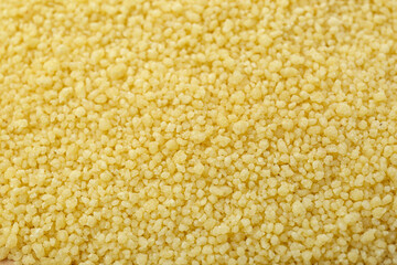 Closeup view of raw couscous as background