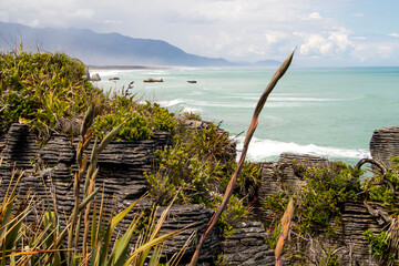 Fototapeta na wymiar View of the Pancake Rocks near Punakaiki, New Zealand, with ocean