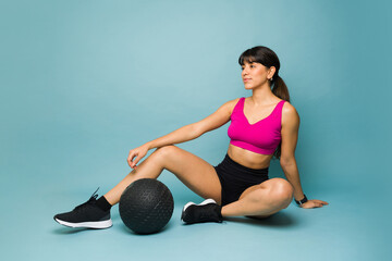 Full length of a beautiful latin woman doing cross training