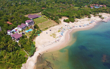 Naklejka na ściany i meble Aerial view of a tropical hotel, villa spa for luxury relaxation. Beautiful tourist wallpapers for for advertising. Asian landscape, photo from the drone