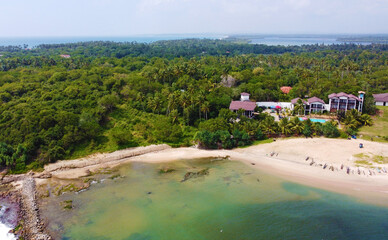 Fototapeta na wymiar Aerial view of a tropical hotel, villa spa for luxury relaxation. Beautiful tourist wallpapers for for advertising. Asian landscape, photo from the drone