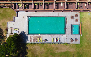 Obraz premium Aerial view of the empty pool near the hotel. Beautiful tourist wallpapers for for advertising. Asian landscape, photo from the throne