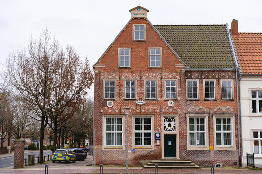 NORDEN, AURICH DISTRICT, LOWER SAXONY, GERMANY - FEBRUARY 23, 2023: Police station in Norden, district of Aurich, Lower Saxony, Germany. Historic brick building near the North Sea shore, East Frisia.