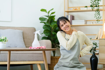 Asian woman House wife or housekeeper feeling tired after home cleaning