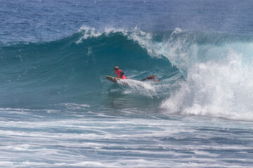 Obraz premium TENERIFE, SPAIN 11- AUGUST- 2013: boy competing in men's bodyboard championship. Tenerife, Canary Islands, Spain: boy competing in a bodyboarding championship, performing incredible maneuvers