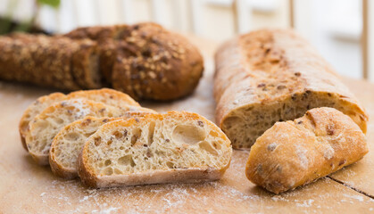 fresh loaf of bread on wooden board