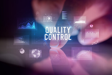 Finger touching tablet with business graphs and icons concept